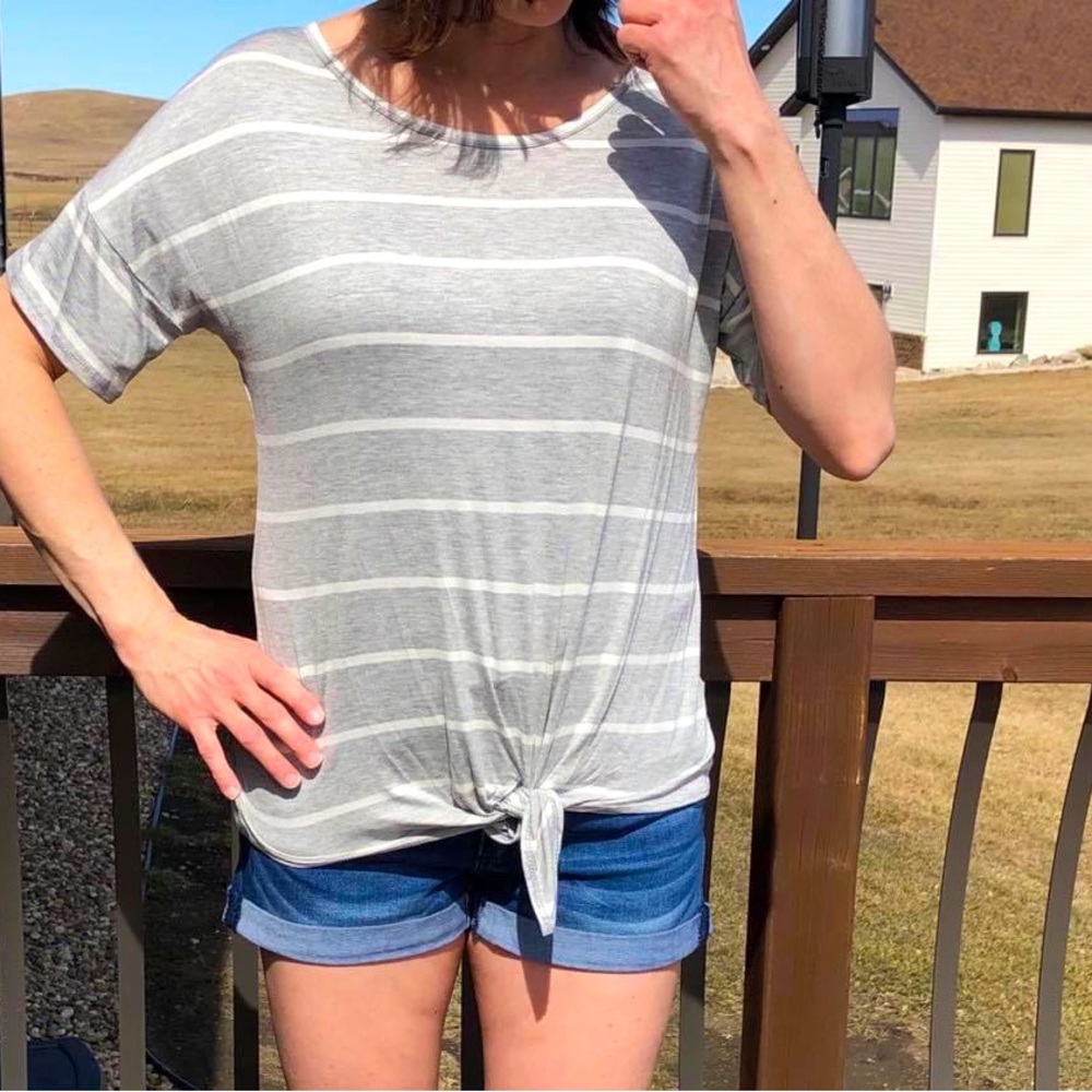 Gray and white strip tshirt with from tie and criss cross detail on back